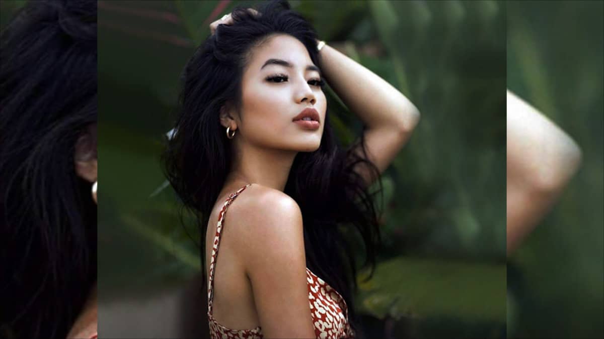 Posing young Filipino lady - jungle background.