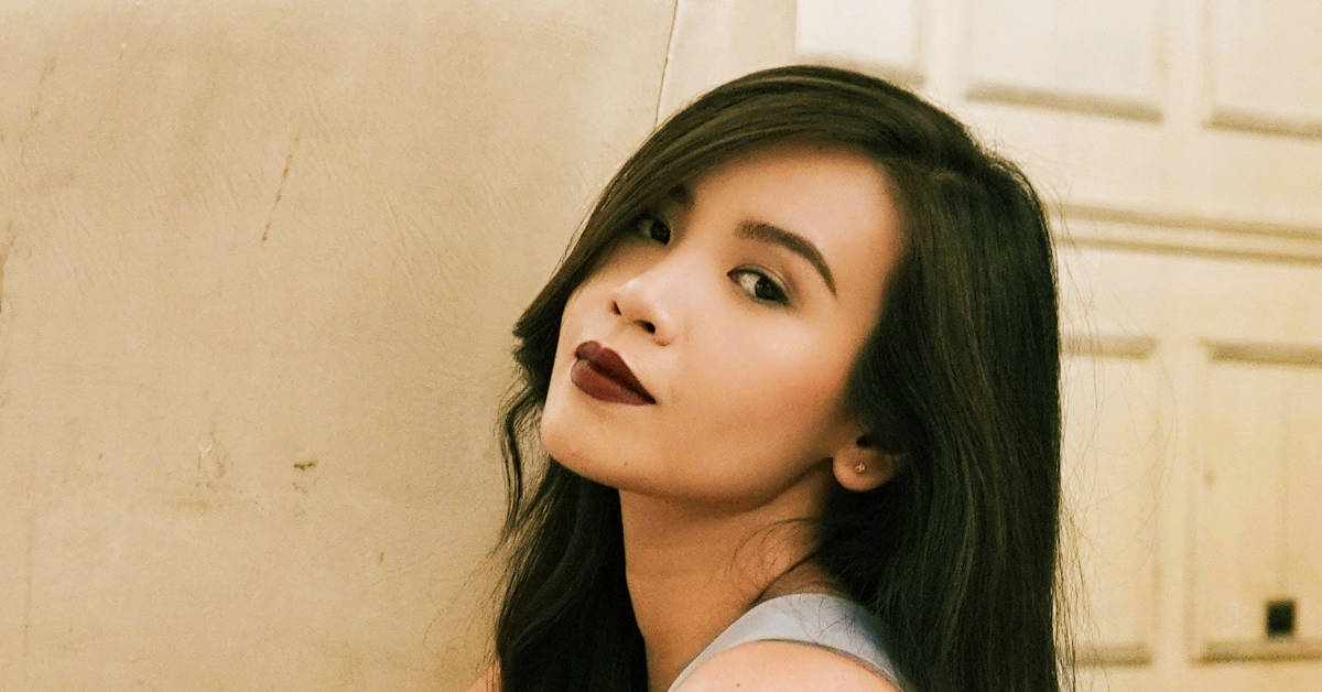 Filipino woman with makeup and red lips