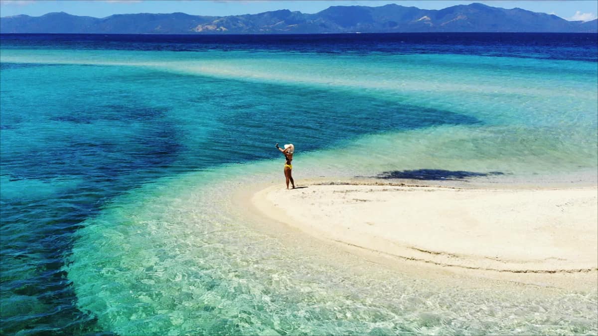 Filipino woman on deserted Philippines beach