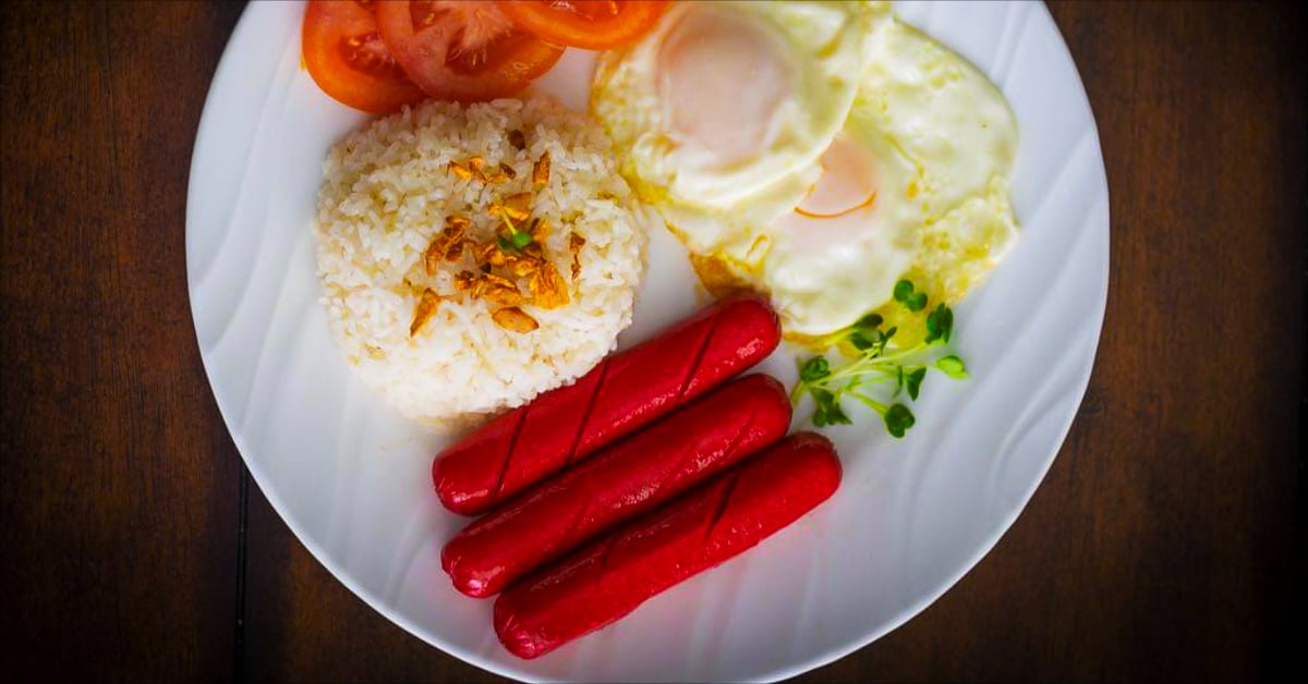 A plate of Filipino Hotsilog, garlic friend rice and fried eggs